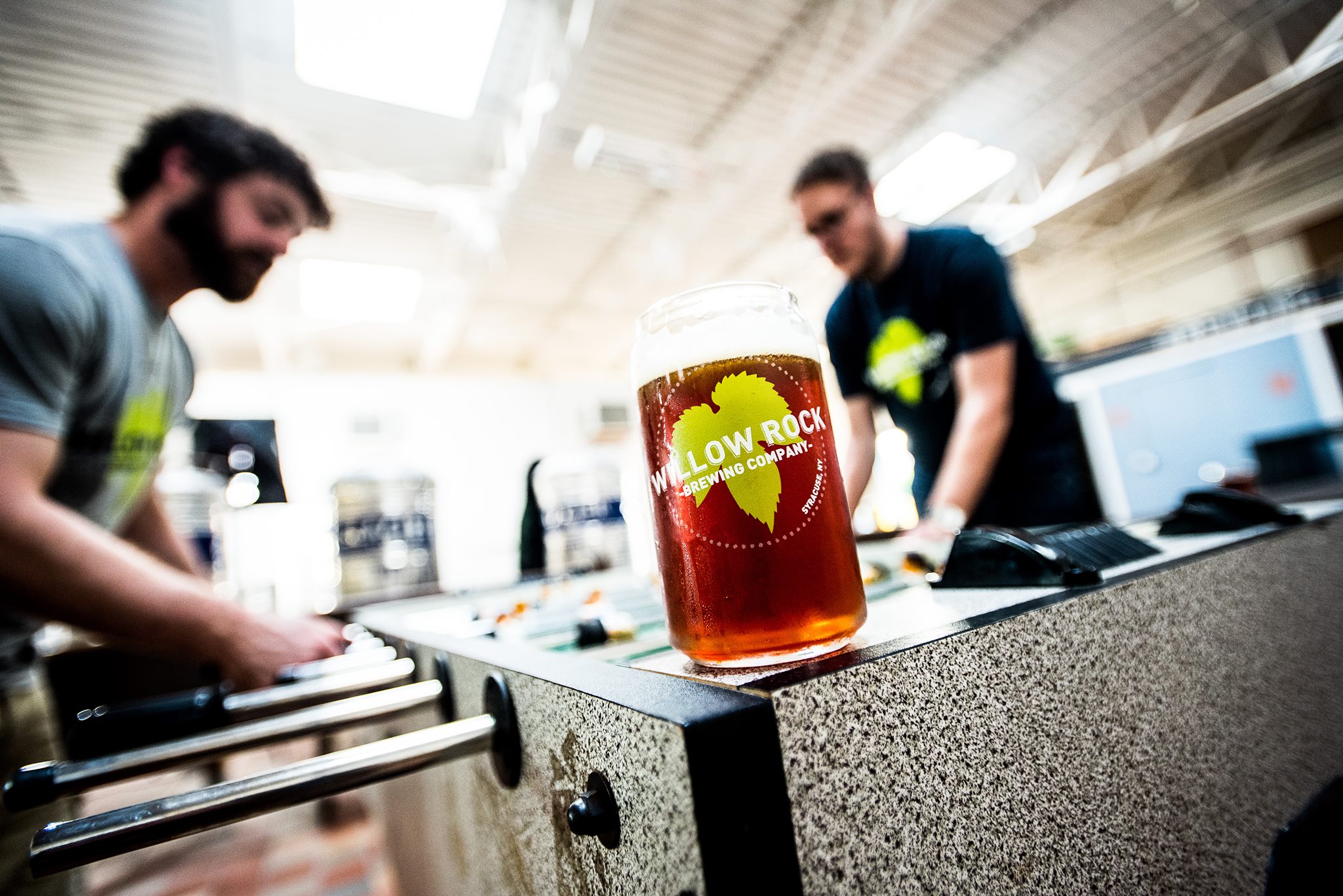 Willow Rock head brewer inspecting a batch in the brewhouse